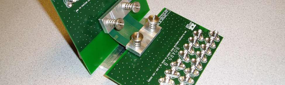 062 thick FR-4 printed circuit boards, with appropriate highbandwidth thru-board microstrip-to-microstrip transitions.
