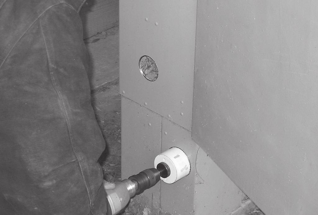 cable port jumper port 5.5 Mark the location of entrance between cabinets on the wall of the existing cabinet. This should be centered on the trough opening.