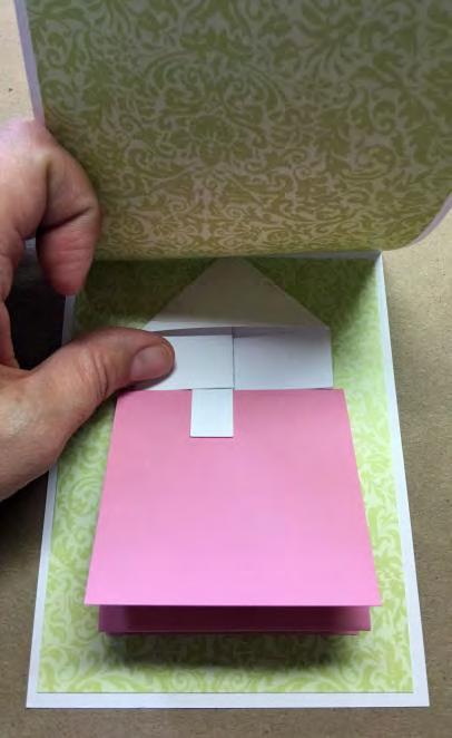 16. Remove tape liners, and adhere panel/mechanism to the lower section on the card base inside.