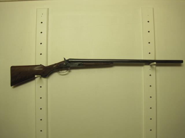 48. W. Mocke muzzle loader 49. Hawthorne mod.880 22 LR semi auto rifle w/sling 50. W. Moore side-by-side muzzle loader 51.