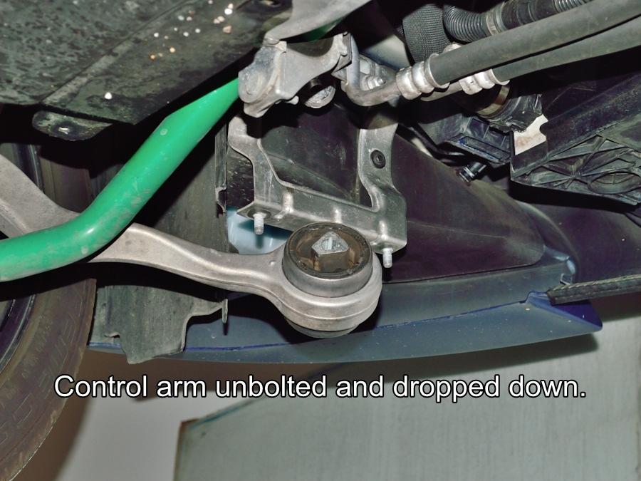 #3 Remove the bolt from the control arm mount then pull down the control arm as shown. The stock rubber bushings need to be cleaned and lubed before pressing them through the control arm bores.