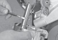 C] Attach assembly to lower compressor bracket ear by applying anti-seize to