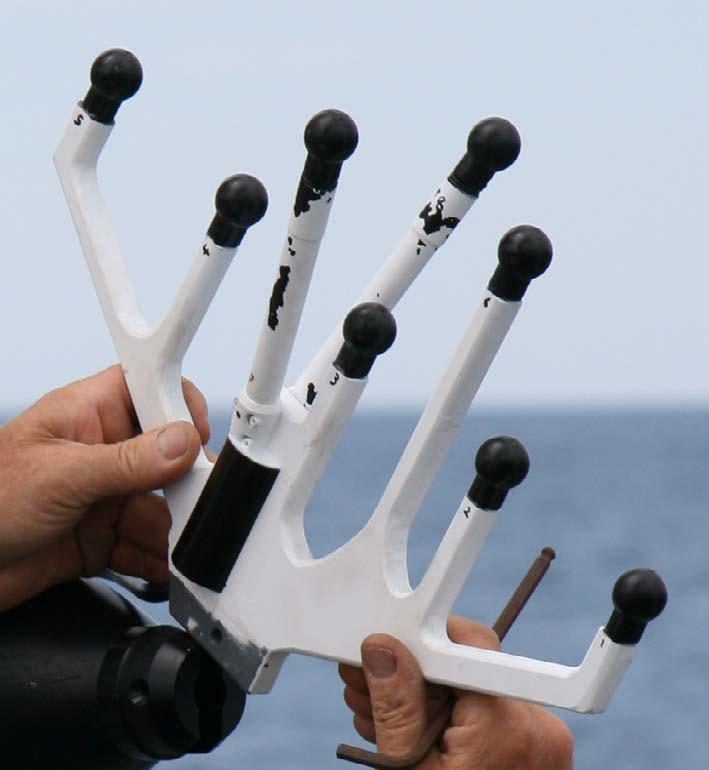 a) b) Figure 5: (a) Tetrahedral and line array mounted to the nose of the efolaga AUV. Five elements comprise a vertical line array. The middle element of the line is one vertex of a tetrahedron.
