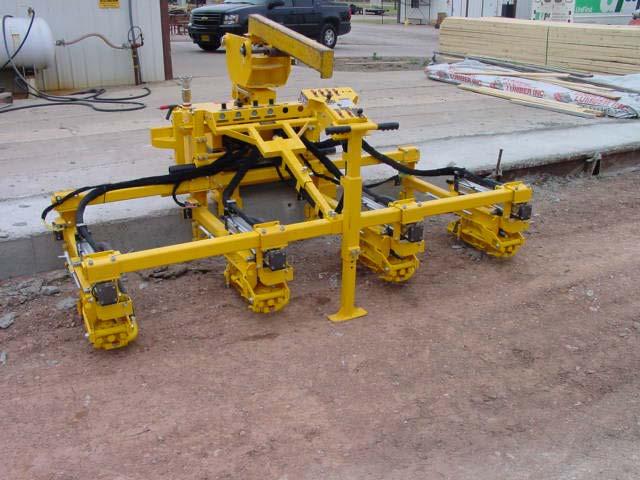ADJUSTING THE DRILL SPACING IMPORTANT: The following instructions need to be followed after the backhoe has placed the drill on the slab in the