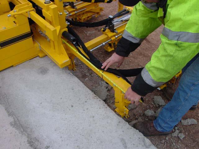 ADJUSTING THE DRILL SPACING Be sure to measure from both ends of the feed bar to insure the drill systems