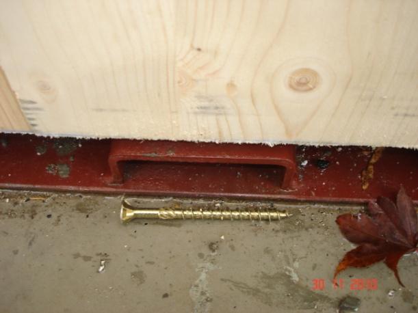 using metal brackets or plates with anchor