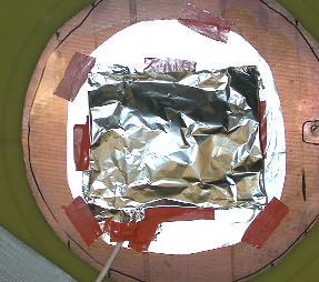 The foil box also covered the area where the shielded cable connected to the PZT patch. A picture of the foil box enclosing the PZT is shown in Figure 20.