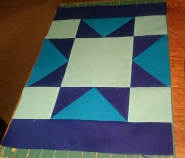 19 Assembling the Block Sew the short royal blue strips to the