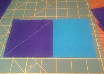 dark (royal blue) square on top of one-half of the medium (teal) rectangle