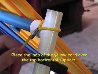 7. Place the loop of the yellow cord over the top horizontal support. 8. Thread the other end as shown.
