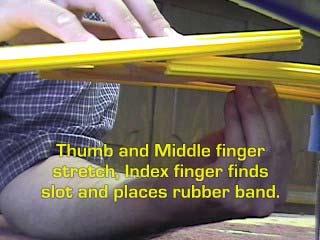 Use Your Thumb and Middle finger to stretch the band and your Index finger to find the slot and
