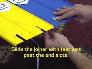 19. Slide the joiner with feet just past the end slots.