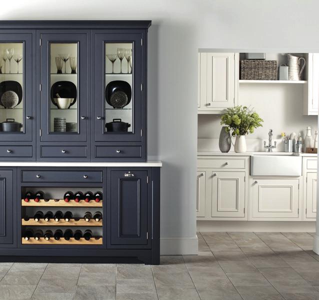 Smart decorative features, including practical bottle store drawer units, chopping board and tray sets, as well as glazed doors, allow for imaginative