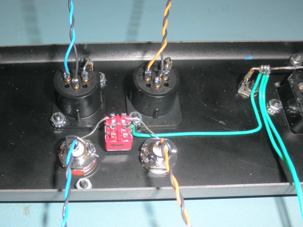 16. Wire the right output RCA jack: You will now install the black/orange twisted pair that you just made.