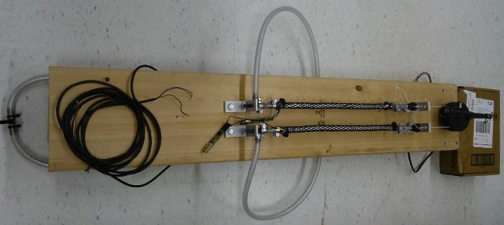 III. BUILDING TEST FIXTURE A. Introduction McKibben Artificial Muscle: Each braid was fitted to silicone tubes with outer diameter of 9.5 mm to form an actuator.