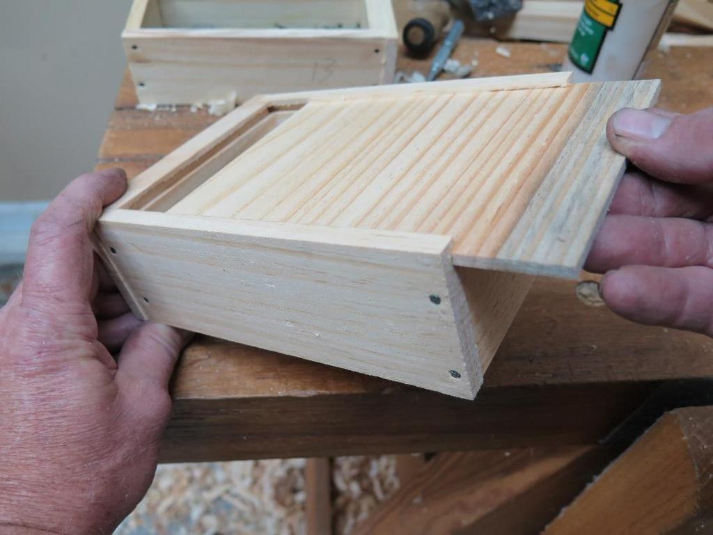 No glue is added to the drawer bottom so it can float in the groves, just a nail into the