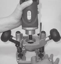 Remove the collet nut (9), spring (21) and router bit collet (22) from the router. 3.