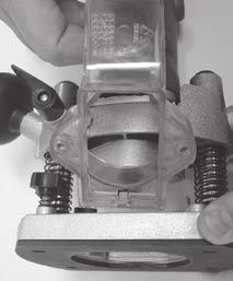 Place your hand on the upper body of the router assembly and separate the router body from the base (Fig.8). 5.