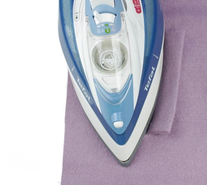 23. Lay the pocket right side up on the ironing board, with a cloth between