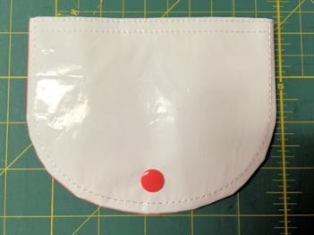 Press edges to set seam. 7 Turn right side out. Press flap.