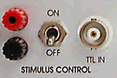 STIMULUS CONTROL section: (11) TTL IN connector BNC connector for a TTL input signal to switch the headstage from recording mode (TTL = low) to stimulation mode (TTL = high).