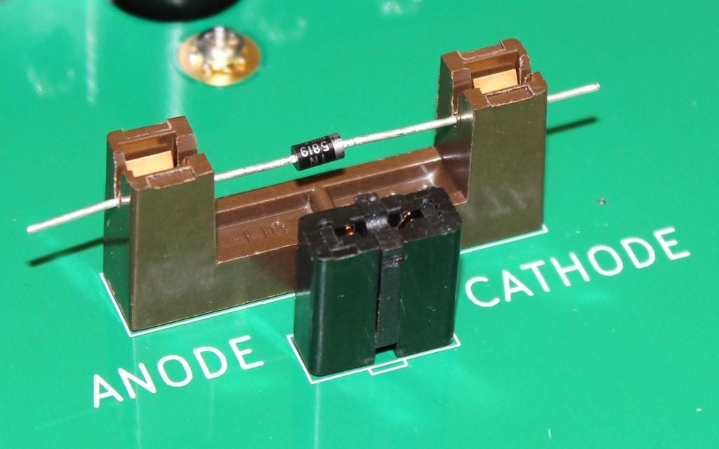 To install a DUT, open the main (black) lid like this: Install a diode in one of