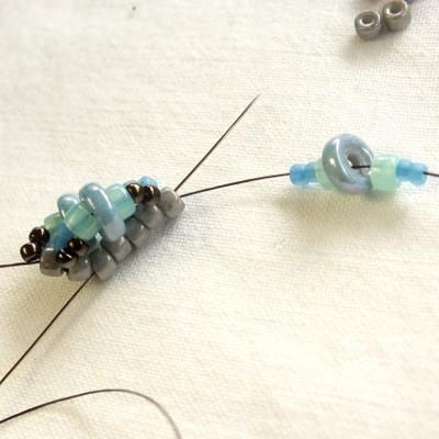 10) Add one core bead and one set of loop beads