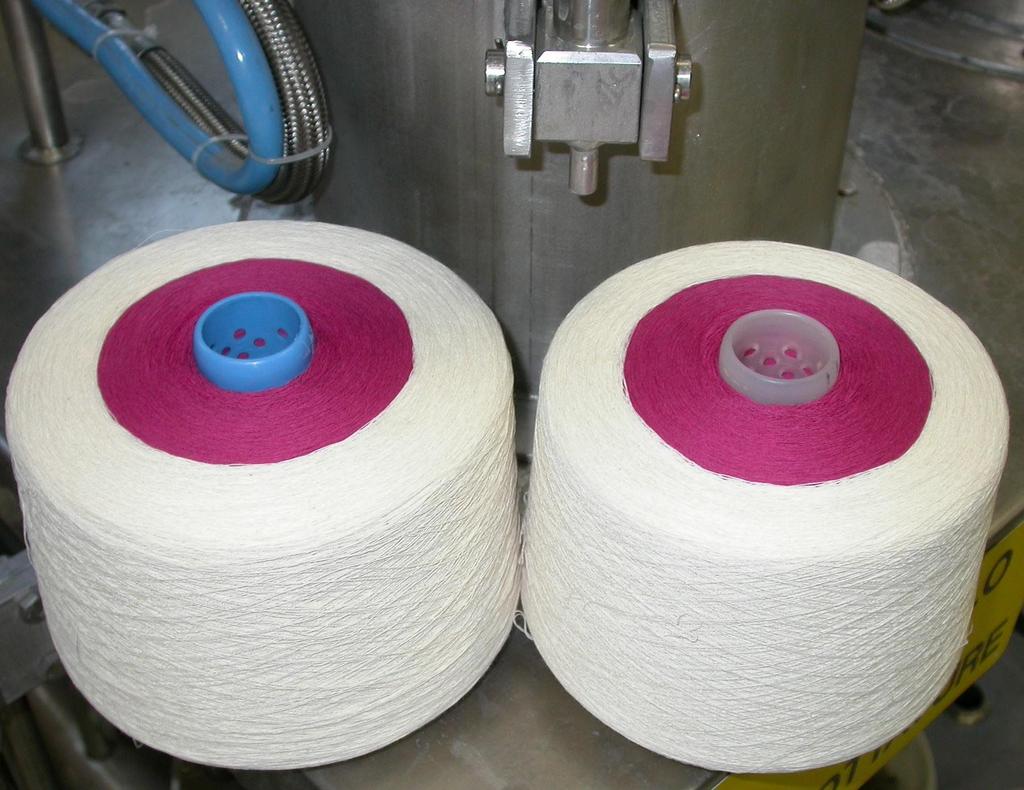 Untreated packages of yarn made with undyed cotton and cotton