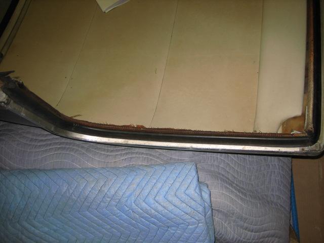 Once the shell is now outlined with aluminum, the headliner that floats can be pushed into place. Attach the gray inside rear supports in the rear glass opening Now comes the rear glass.