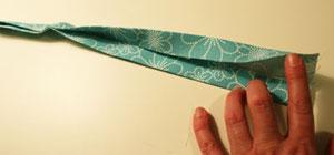 To prepare the strap, cut a piece of fabric to 36" long by 4" wide.