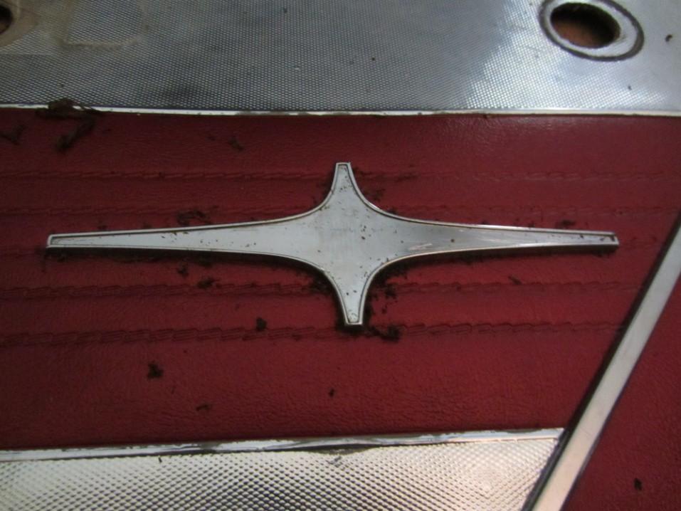 Image 8 7. Use a small amount of lacquer thinner on a Q-tip to clean the remaining glue residue from the emblem base.