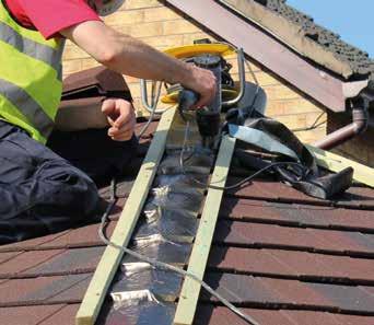 Using a ridge tile to set the width, fix timber battens over ridge and