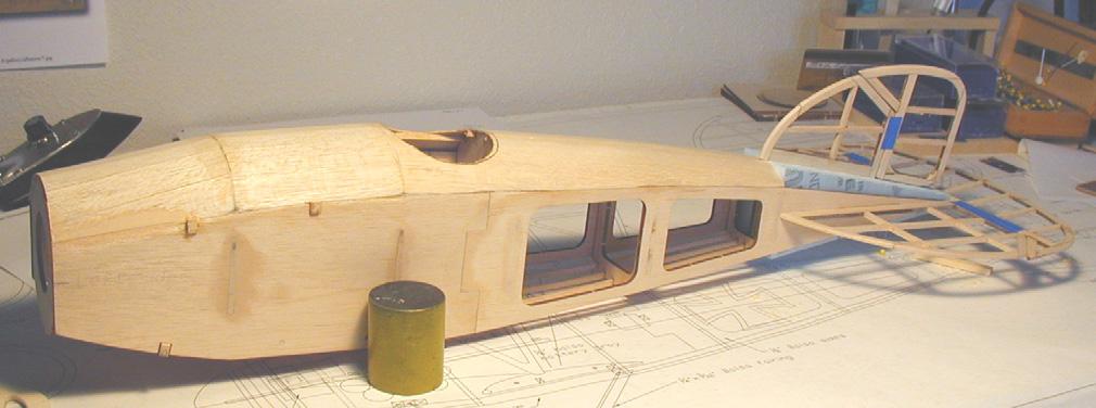 Use a length of 1/4 diameter birch or hard balsa dowel at the end of the fuselage.
