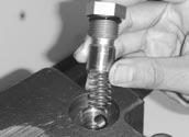Install the low pressure relief valve plunger and spring.