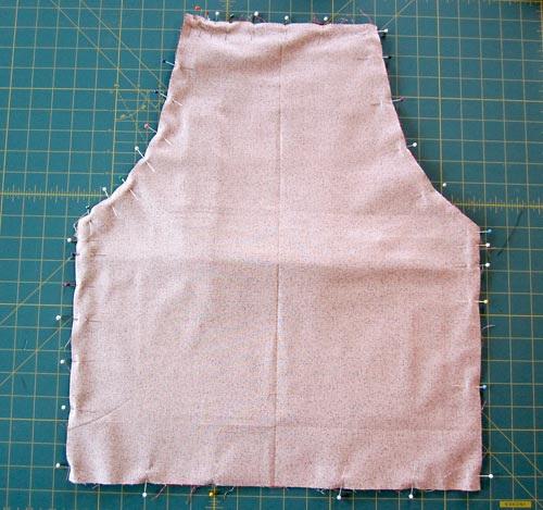 10. Using a ½" seam allowance, stitch all the way around the apron, locking your seam at either side of the 3" - 4" opening.