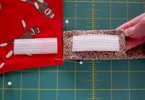 We like to use fusible seam tape. 20. Stitch the Velcro in place on each piece with a box stitch. NOTE: We stayed with our contrasting red thread to stitch the Velcro in place.