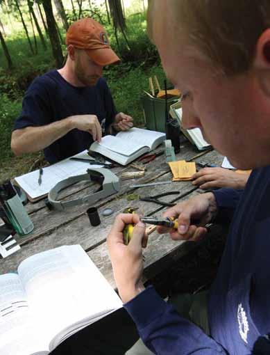 Eric Soehren and John Trent band birds at the Monitoring Avian Productivity and Survivorship (MAPS) banding station on the Wehle Tract, one of more than 500 such stations in the United States.