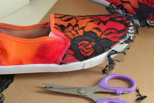 On the back side of your lace piece brush on some Fabric Fusion. Place over the shoe and press down onto the shoe's canvas.