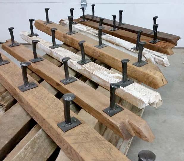 Coat Racks with Railway Spikes Made with salvaged materials from aged barns (knee-braces, corner-braces, antique ladders, drag harrows, hand-rails,
