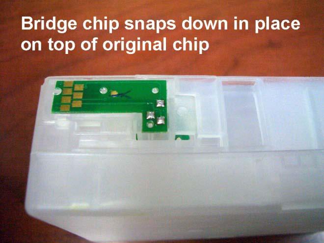 The bottom surface of the recess has two lugs molded in that line up with the two holes in the original chip, so that it can be located correctly.
