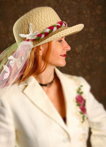 Lay flat with top sides up to dry. Tie the end of the three pieces of tulle together with the knot six inches from the end. Braid the long ends the length of the front of the hat. Tie a knot.