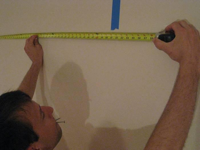 Simply level the first hanger at the 1/3 screen width location, rest a level to bridge to the second hanger, and install