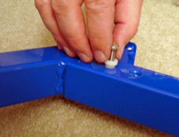 Remove screws and Nylon Stabilizing Bushing from angled end of the forward longitudinal frame and insert the