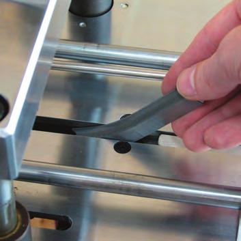 Use the Magnetic Tool (T) to pull the partly used strip of wedges, out of the magazine.