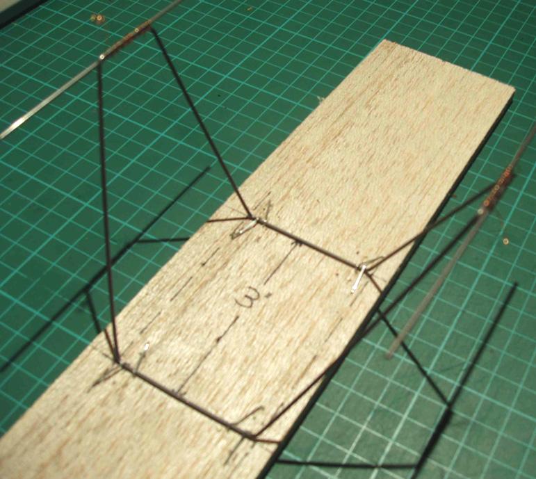 Using the plans as a guide cut and shape 1/16 music wire to form the two UC supports. Glue together the ply UC sides and set aside, these can be smoothed/sanded after bonding to the wire legs.