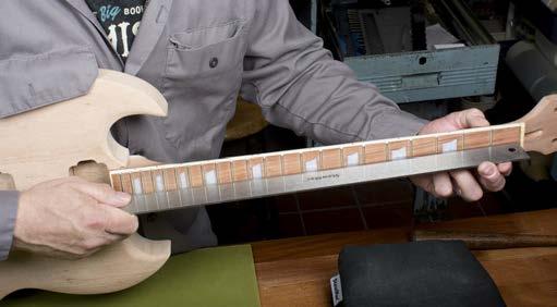 Run your fingers lightly along the edge of the fretboard and feel for sharp fret ends.