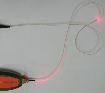 Operating Instructions It emits a visible 650 nm wavelength red laser light through fiber optic cables