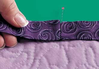 4. Fold the binding up, along the diagonal stitching line (Photo