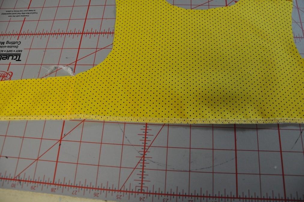 The overlay is not sewn in the side seam. After your overlay is pinned on, sew your straps and shoulder seams.