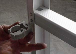18. Use a drill with a Phillips bit to fasten the (#5) Plastic hose Clamp to the ladder with a (#6) self tapping screw as shown below in Figure 14a.